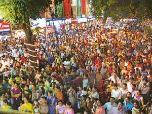 Crowds of shoppers stop to gaze at the prizes of the lucky draw scheme announced by the Sector 22 market in Chandigarh on Wednesday.