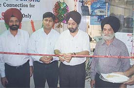 Mr G.S. Julka, general manager, BSNL, cuts the ribbon at the inauguration of online cash counter