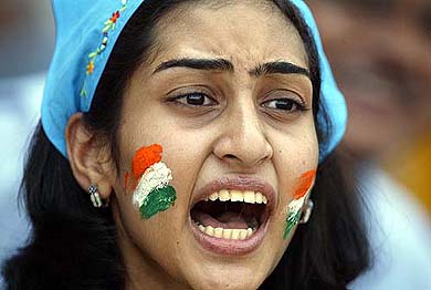An Indian fan cheers her team