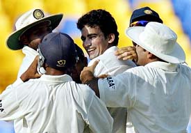India's Zaheer Khan is congratulated by teammates