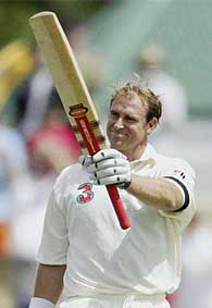 Australian cricketer Matthew Hayden raises his bat to acknowledge the crowd after scoring his 200 runs during day two of the first Test against Zimbabwe in Perth, Australia, on Friday. Hayden made 380 runs and set a new record.