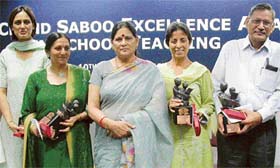 The teachers who have been awarded for excellent work in their fields with Mrs Sobha Verma, wife of the Punjab Governor