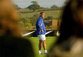 Onlookers watch as Brazil's Ronaldo takes part in a squad training session