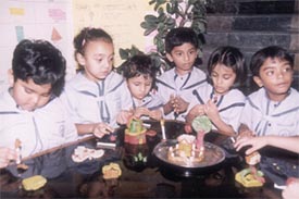 Children give shape to their dream houses during the 'My House' competition held at Children's Valley School