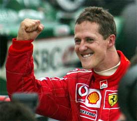 Ferrari's German driver Michael Schumacher celebrates after winning the record sixth world championship title 
