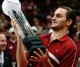 Roger Federer of Switzerland holds his trophy after winning the CA-Trophy final against Carlos Moya of Spain 
