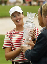 Sophie Gustafson accepts the championship trophy