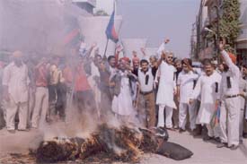 Activists of the Lok Janshakti Party burn effigy of corruption and terrorism