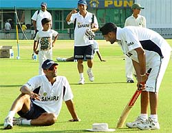 Harbhajan Singh and Anil Kumble share a light moment during a practice session