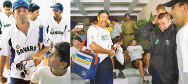 A young cricket enthusiast looks adoringly at Sachin Tendulkar as he goes out on to the field at the PCA Stadium in SAS Nagar for a practice session on Wednesday. (Right) New Zealand team members relax on the steps of Hotel Mountview prior to their departure for the stadium. 