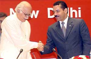 Deputy Prime Minister L. K. Advani shakes hand with Ronald Novel, Secretary General of Interpol, at the third international conference on ''Fugitives'', in New Delhi 