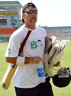 New Zealand's Craig McMillan leaves the ground after a practice session