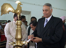 India's External Affairs Minister Yashwant Sinha lights a traditional oil lamp to inaugurate a photo exhibition at the National Art Gallery in Colombo 