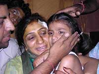 Ashna with her parents after the 11-hour hostage drama in Jalandhar on Thursday.