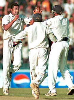 Anil Kumble celebrates with wicketkeeper Parthiv Patel and Akash Chopra after trapping New Zealand opener Lou Vincent lbw 