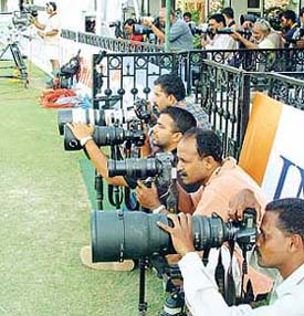 Photo journalists with their sophisticated cameras at the stadium