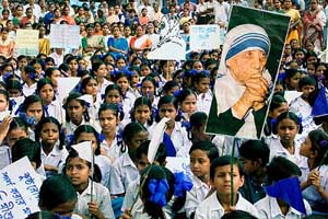 Schoolchildren listen to speeches at a rally