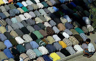 Palestinians pray outside a mosque during a funeral at Rafah refugee camp in southern Gaza Strip 