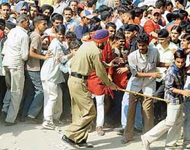 Police personnel resort to mild lathicharge outside the PCA Stadium, SAS Nagar, on Sunday.