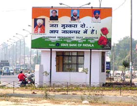 A huge hoarding bears pictures of Punjab Chief Minister Amarinder Singh and other leaders on the national highway in Jalandhar