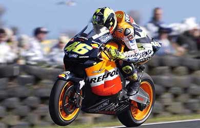 Italian MotoGP world champion Valentino Rossi rides his Honda to victory 