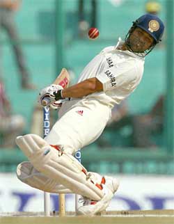 Sachin Tendulkar ducks to avoid a bouncer
