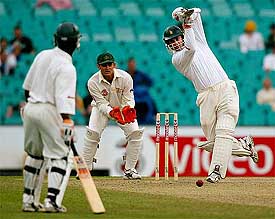 Zimbabwe's Craig Wishart drives Australian fast bowler Brad Williams 
