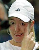Justine Henin-Hardenne of Belgium wipes away a tear 