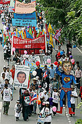 Protesters march along a street during an anti-US demonstration in Bangkok 