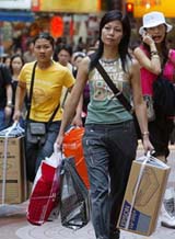 Tourists shop at a Hong Kong shopping mall 