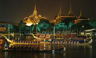 Traditional barges cruise past the Grand Palace during a cultural presentation for the leaders of Asia-Pacific Economic Cooperation 