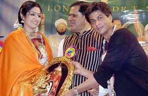 Bollywood star Shahrukh Khan felicitates actress Sridevi at a function in Mumbai 