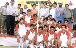 The Ganga School Under-19 team, which lifted the CBSE North Zone Hockey Tournament title, with chief guests Satish Golcha and Sheodeen Singh Yadav, school manager Sushil Kumar Gupta, chairman P K Chandla and Principal H Srow.