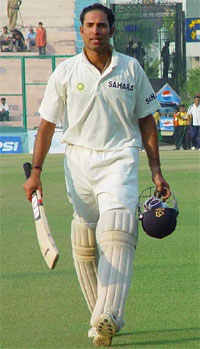Man-of-the-series V. V. S. Laxman walks out of the ground at the end of play on the fifth day of the final Test against New Zealand