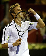 Spain's Juan Carlos Ferrero reacts after winning the final against Chile's Nicolas Massu to win the Madrid Masters ATP tennis tournament 