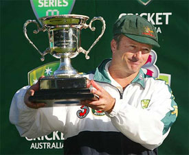 Australian cricket captain Steve Waugh holds the Southern Cross Trophy after his team's victory over Zimbabwe 