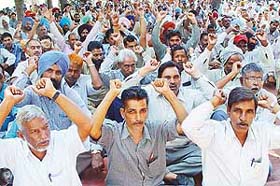 Members of the Federation of UT Employees & Workers protest at Matka Chowk, Sector 17, Chandigarh