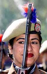 A policewoman holds a rifle at the Police Commemoration Day ceremonies in Zewan, near Srinagar
