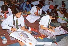 Students from different schools take part in chart-making competition organised by the District Education Department at Guru Nanak Khalsa High School, Model Town, on Wednesday.