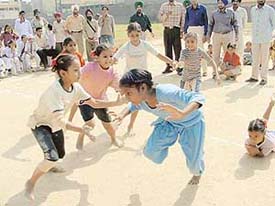 Primary class girls take part in a kabaddi match during the 22nd District Elementary Sports organised at Government Senior Secondary School, Bharat Nagar, on Wednesday.