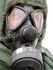 An Army jawan displays gas mask and clothing to protect from chemical, biological and nuclear weapons