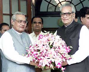 Prime Minister Atal Bihari Vajpayee presents a bouquet to Vice-President Bhairon Singh Shekhawat