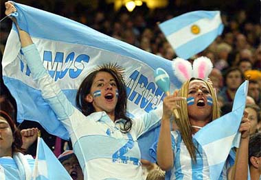 Argentinean supporters celebrate as their team scores during their Rugby World Cup clash against Romania