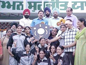 The winning Punjab handball team with Director Kartar Singh