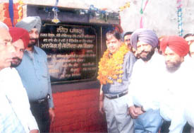 Municipal Council chief Joginder Pal Singla lays the stone of a tubewell in ward No