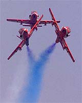 Indian Air Force planes perform at an air show in Baroda 