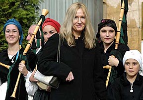British writer Joanne Kathleen Rowling, author of "Harry Potter", poses with bagpipers on her arrival to the Spanish northern town of Oviedo