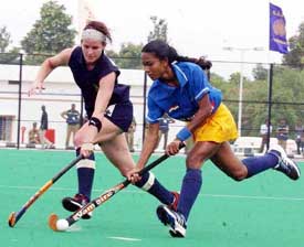 India�s Jyoti Kullu battles for the ball with Bee Kerry of South Africa 
