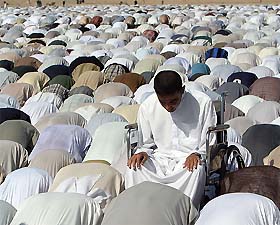 A youth in a wheelchair attends Friday prayers in the restive town of Falluja 