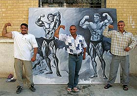 Three bodybuilders pose in the front of an oil painting of movie star and California Governor Arnold Schwarzenegger